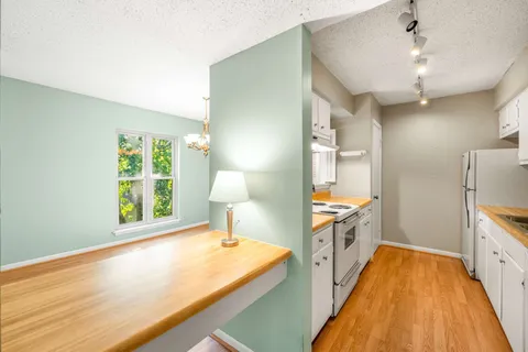 a spacious bathroom with a sink and a large mirror