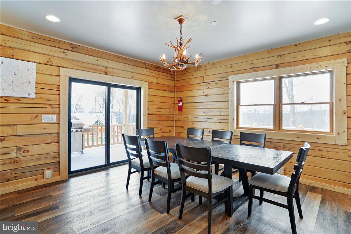 957 North Camp Road McHenry, MD 21541 - Photo 14 of 53 a view of a dining room with furniture window and wooden floor