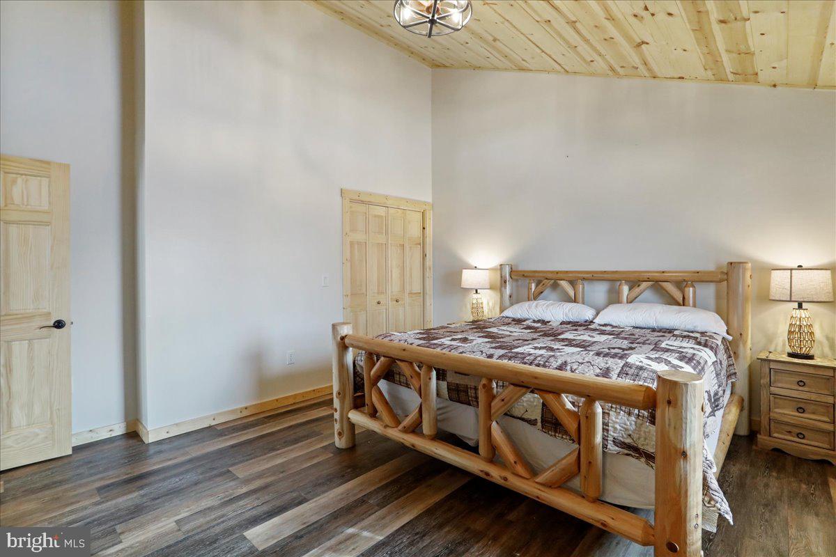 957 North Camp Road McHenry, MD 21541 - Photo 28 of 53 a bedroom with a bed and a dresser