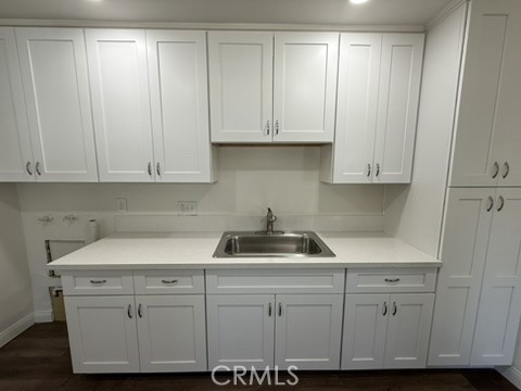 8044 Michael Drive San Bernardino, CA 92410 - Photo 16 of 22 a kitchen with white cabinets and white appliances