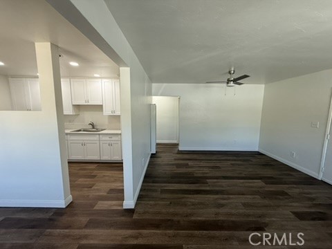 8044 Michael Drive San Bernardino, CA 92410 - Photo 6 of 22 a view of a kitchen cabinets and wooden floor