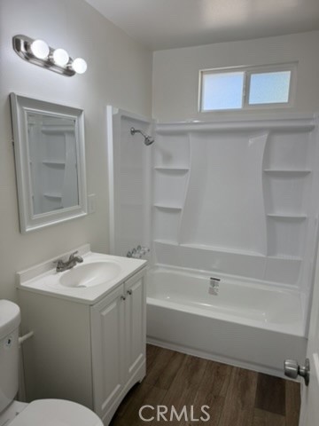 8044 Michael Drive San Bernardino, CA 92410 - Photo 7 of 22 a bathroom with a sink a toilet and shower