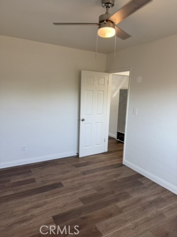 8044 Michael Drive San Bernardino, CA 92410 - Photo 8 of 22 a view of an empty room with window and wooden floor