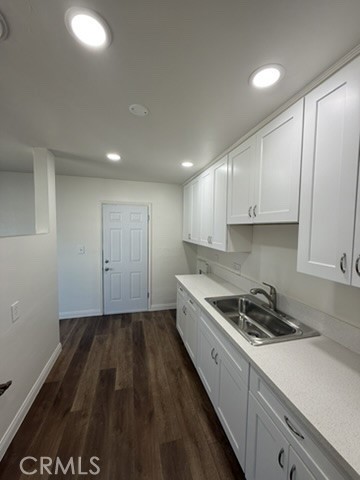 8044 Michael Drive San Bernardino, CA 92410 - Photo 9 of 22 a kitchen with a sink and cabinets