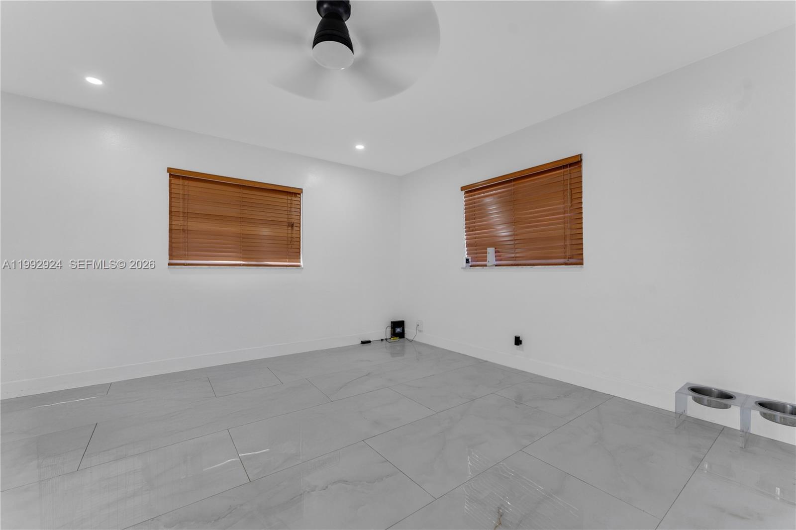 6924 Northwest 8th Court Margate, FL 33063 - Photo 19 of 38 a view of an empty room with a window