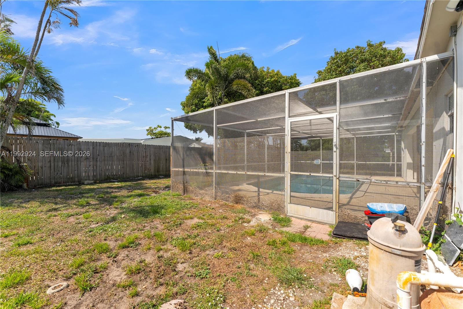6924 Northwest 8th Court Margate, FL 33063 - Photo 31 of 38 a backyard of a house with seating space