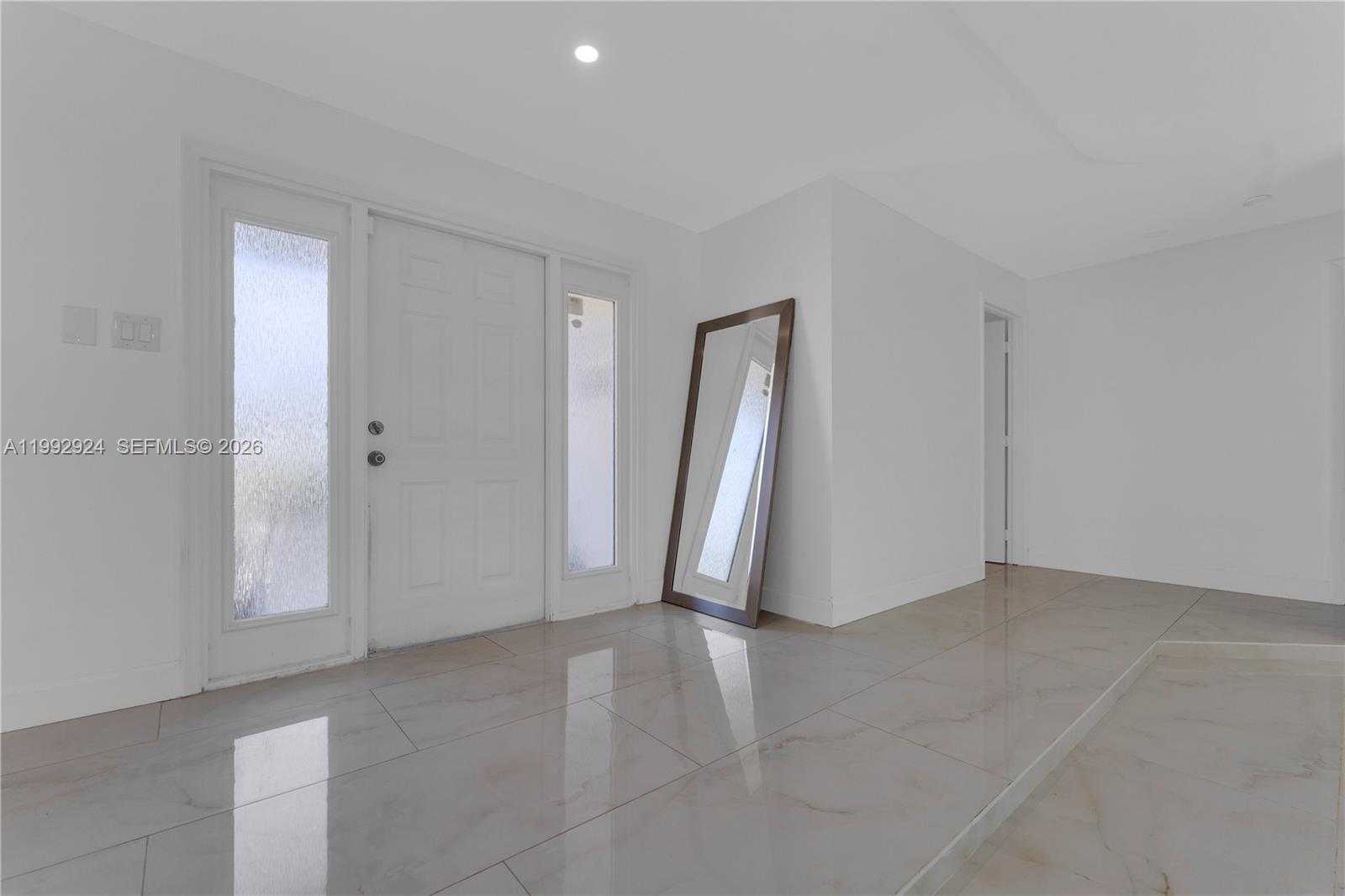 6924 Northwest 8th Court Margate, FL 33063 - Photo 7 of 38 an empty room with a natural light