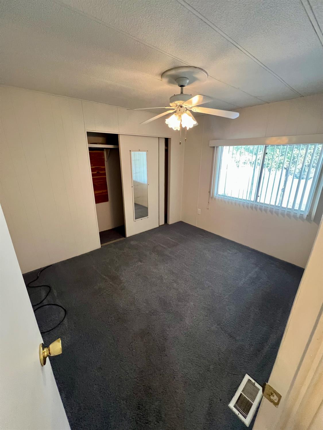 3955 Coffee Road, Unit 53 Modesto, CA 95355 - Photo 14 of 39 a view of livingroom with hardwood floor and ceiling fan