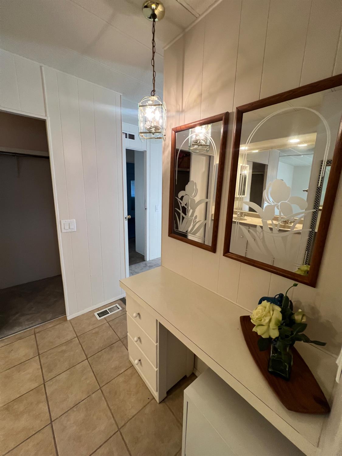 3955 Coffee Road, Unit 53 Modesto, CA 95355 - Photo 8 of 39 a hallway with a large mirror