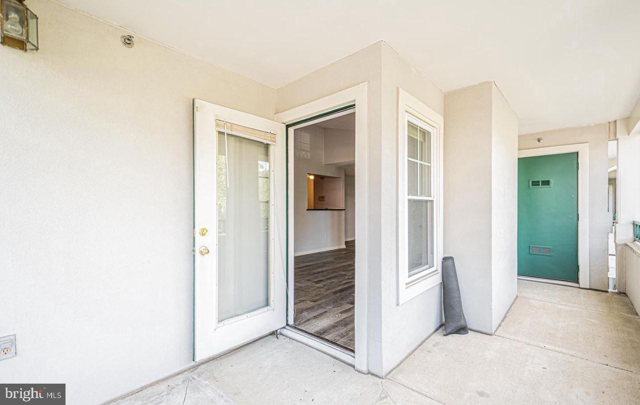 12001 Taliesin Place, Unit 33 Reston, VA 20190 - Photo 21 of 32 Access to your patio from the living room