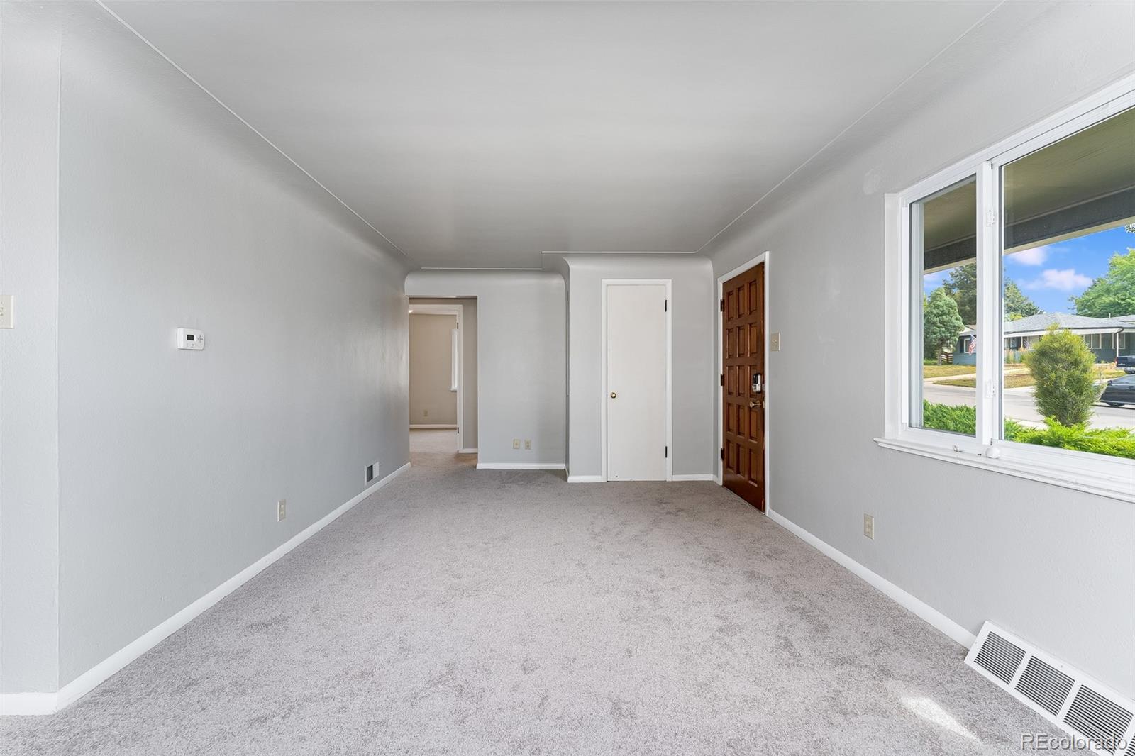 2817 Gray Street Wheat Ridge, CO 80214 - Photo 11 of 18 an empty room with windows