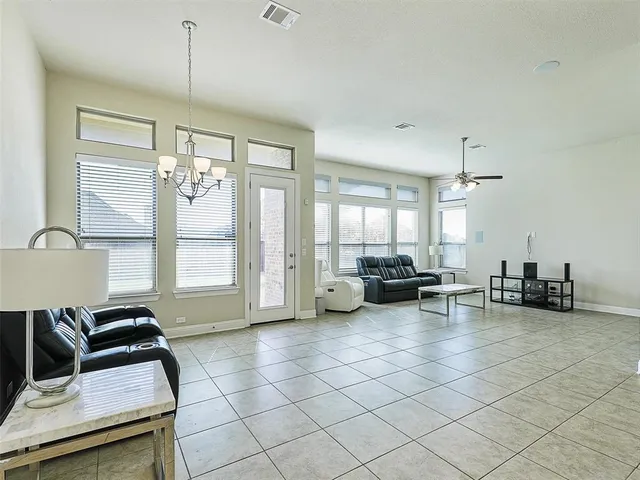 a view of a livingroom with furniture and window