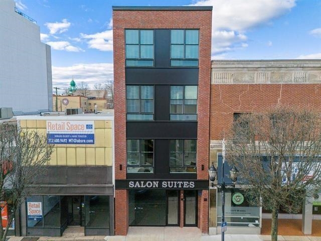 491 Broadway, Unit 402 Bayonne, NJ 07002 - Photo 19 of 20 a front view of a building with a glass door
