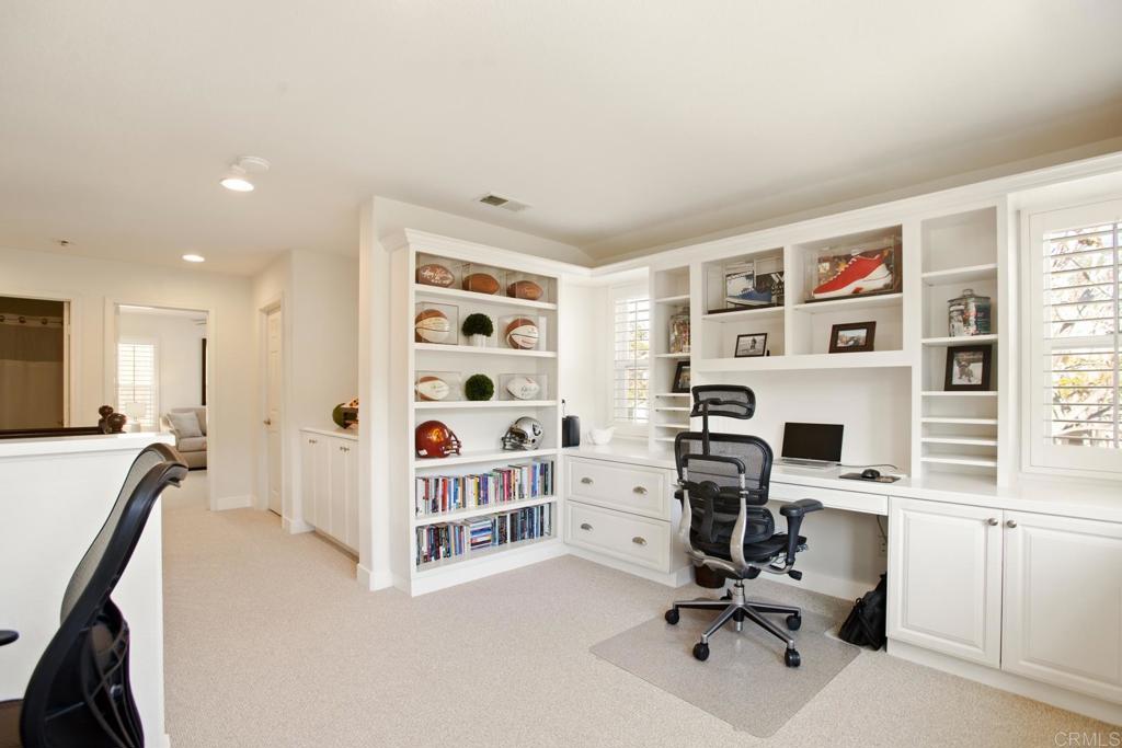 4183 Twilight Ridge San Diego, CA 92130 - Photo 20 of 46 a view of workspace with wooden floor shelves