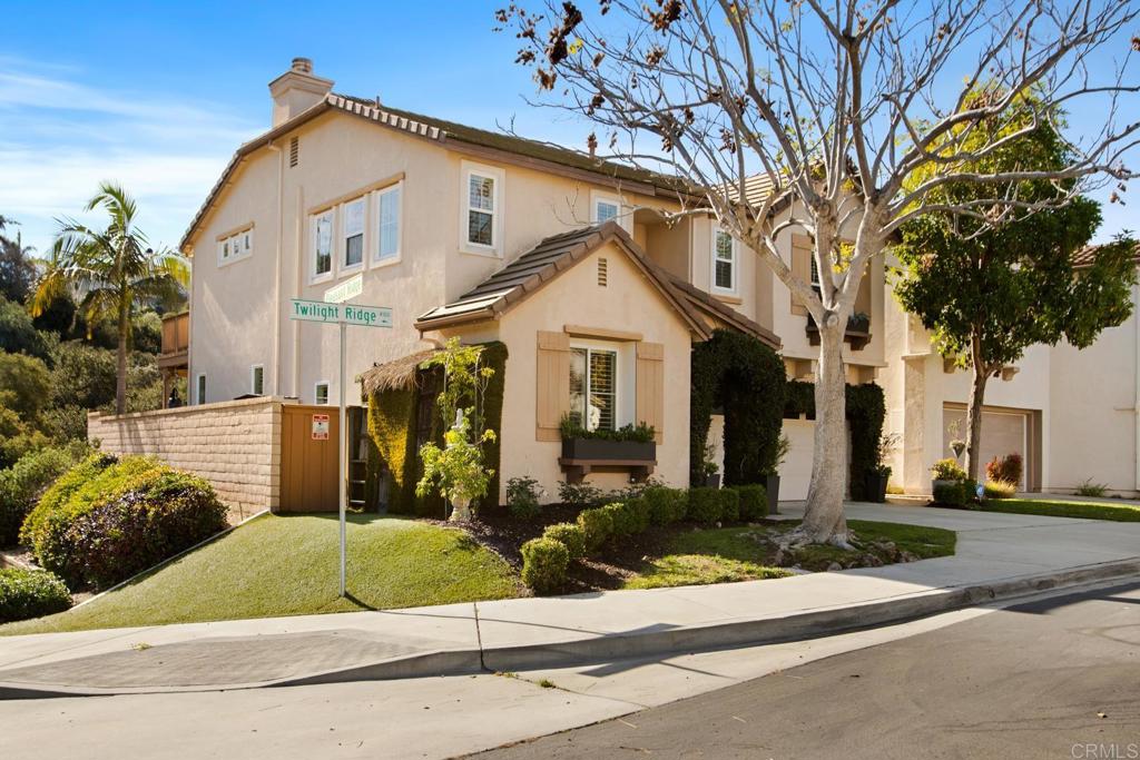 4183 Twilight Ridge San Diego, CA 92130 - Photo 37 of 46 a front view of a house with a yard