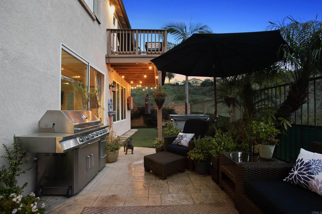 4183 Twilight Ridge San Diego, CA 92130 - Photo 44 of 46 a backyard of a house with yard fire pit barbeque oven and outdoor seating