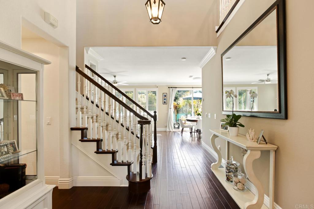 4183 Twilight Ridge San Diego, CA 92130 - Photo 5 of 46 a view of an entryway with wooden floor and windows