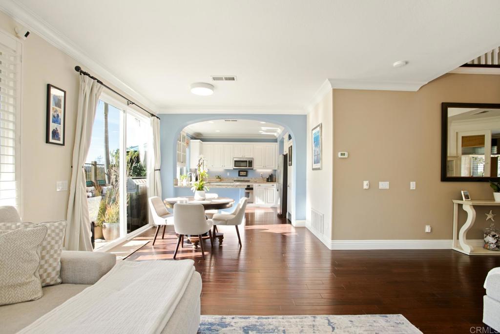 4183 Twilight Ridge San Diego, CA 92130 - Photo 8 of 46 a view of a dining room with furniture and wooden floor