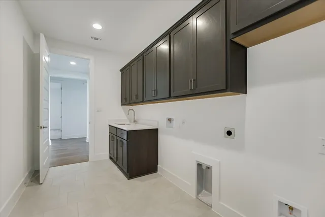 a view of cabinets with stainless steel appliances wooden cabinets and fireplace