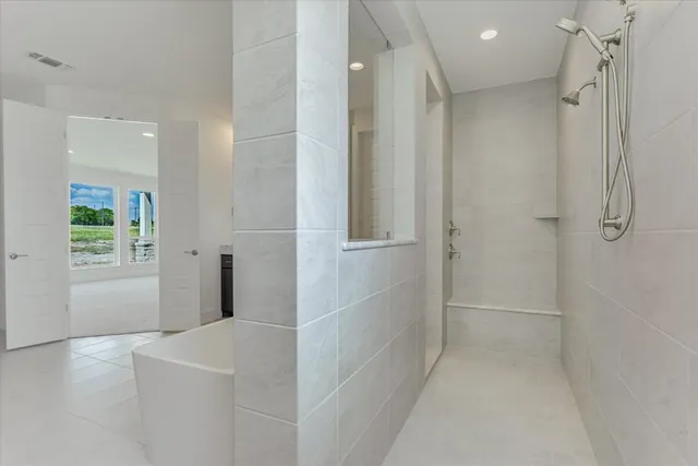 a bathroom with a bathtub and a shower