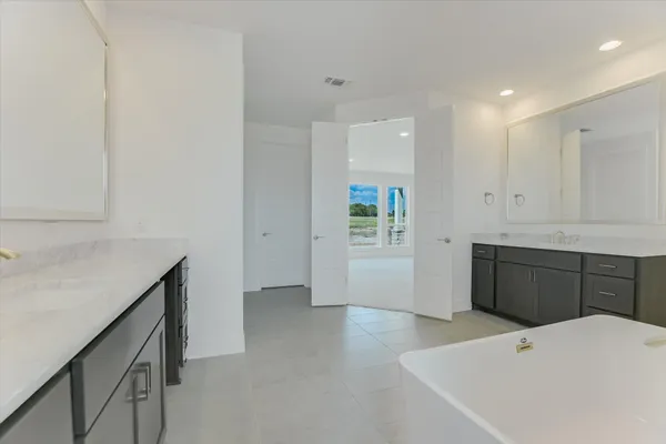 a kitchen with a refrigerator and a sink