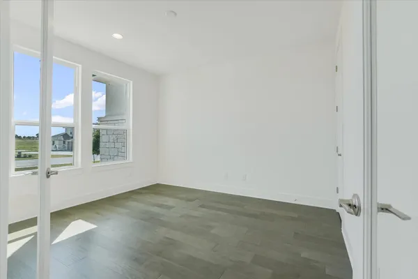 an empty room with windows