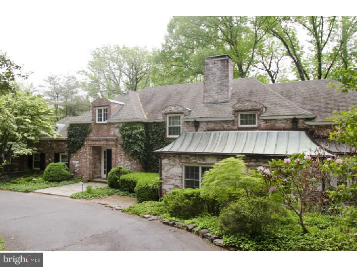 a view of a house with a garden and plants