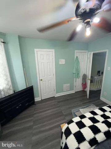a bathroom with a sink mirror vanity and toilet