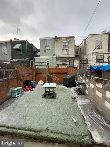 a view of a living room and kitchen