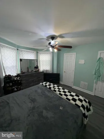 a bedroom with bed and a window