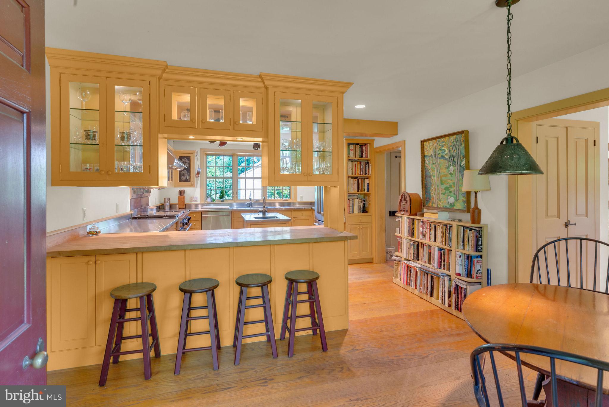 82 Tory Road Pipersville, PA 18947 - Photo 15 of 76 a dining room with furniture a floor to ceiling window and wooden floor