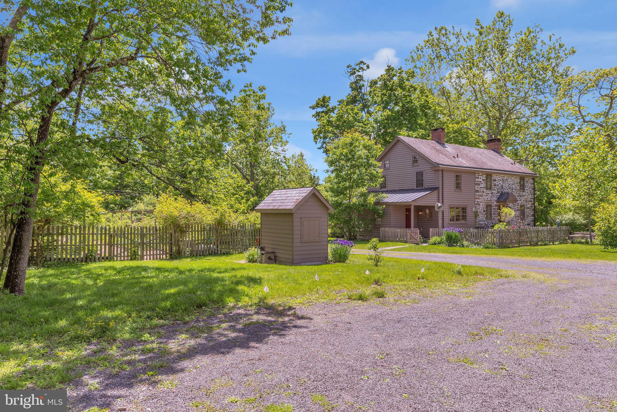82 Tory Road Pipersville, PA 18947 - Photo 54 of 76 a front view of a house with a yard and large trees