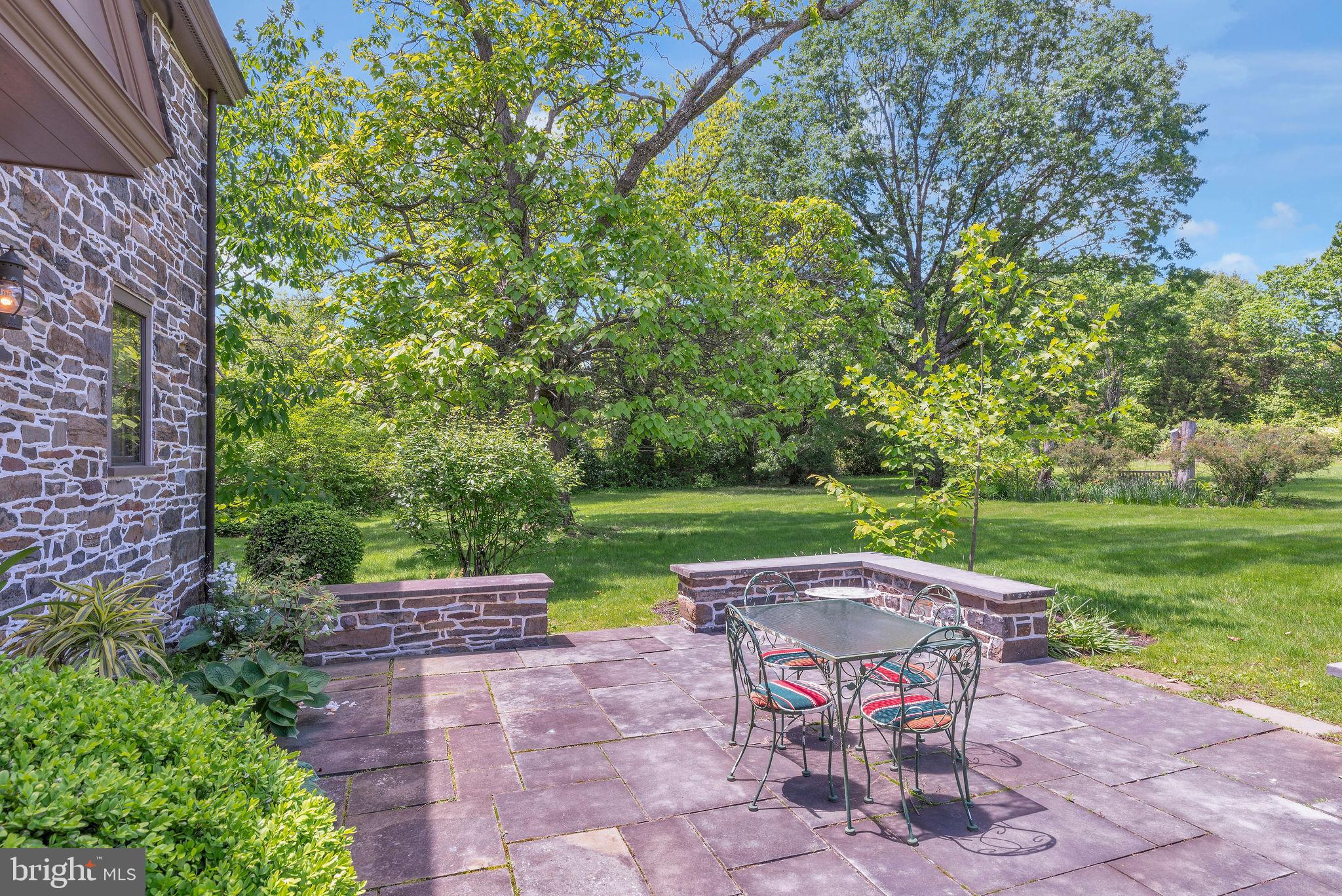 82 Tory Road Pipersville, PA 18947 - Photo 66 of 76 a view of a patio with table and chairs potted plants and a large tree