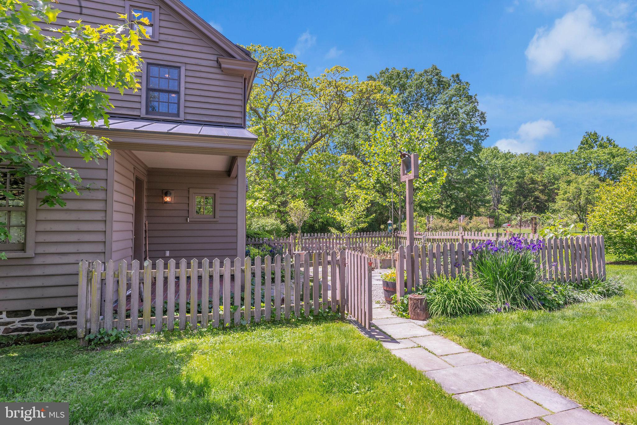 82 Tory Road Pipersville, PA 18947 - Photo 68 of 76 a view of a house with a small yard and wooden fence