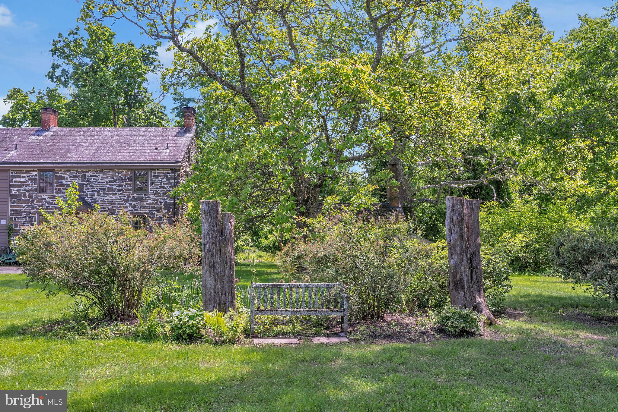 82 Tory Road Pipersville, PA 18947 - Photo 69 of 76 a view of a backyard with large trees and plants
