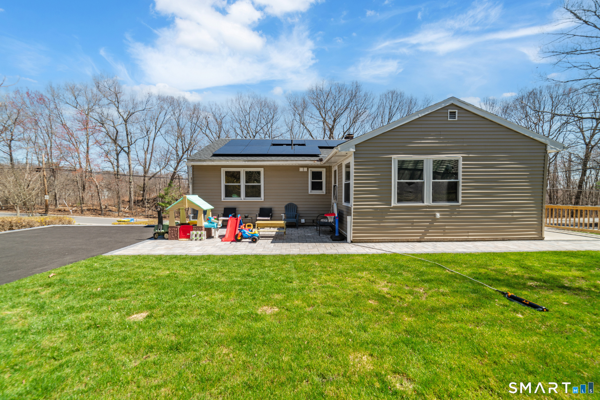 327 Lakeside Boulevard West Waterbury, CT 06708 - Photo 26 of 29 a view of a house with patio and a yard