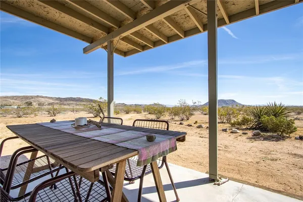 a view of an outdoor space with furniture