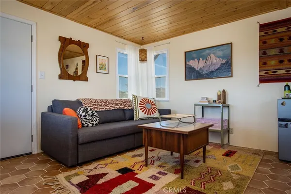 a living room with furniture and a rug