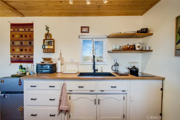 a kitchen with a sink and a stove