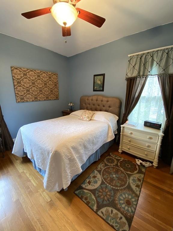 52 Sunapee Street Springfield, MA 01108 - Photo 18 of 33 a bedroom with a bed and wooden floor