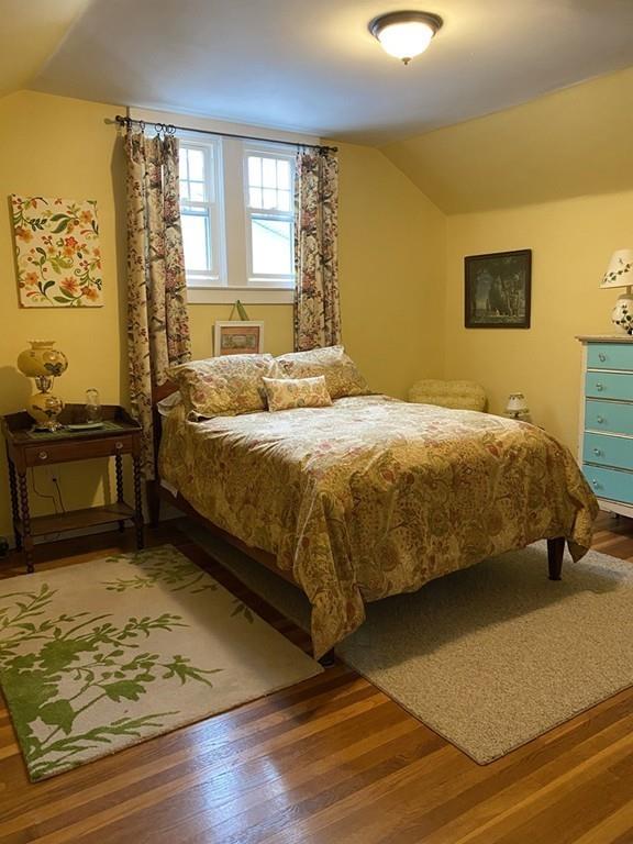 52 Sunapee Street Springfield, MA 01108 - Photo 20 of 33 a bedroom with a bed and wooden floor
