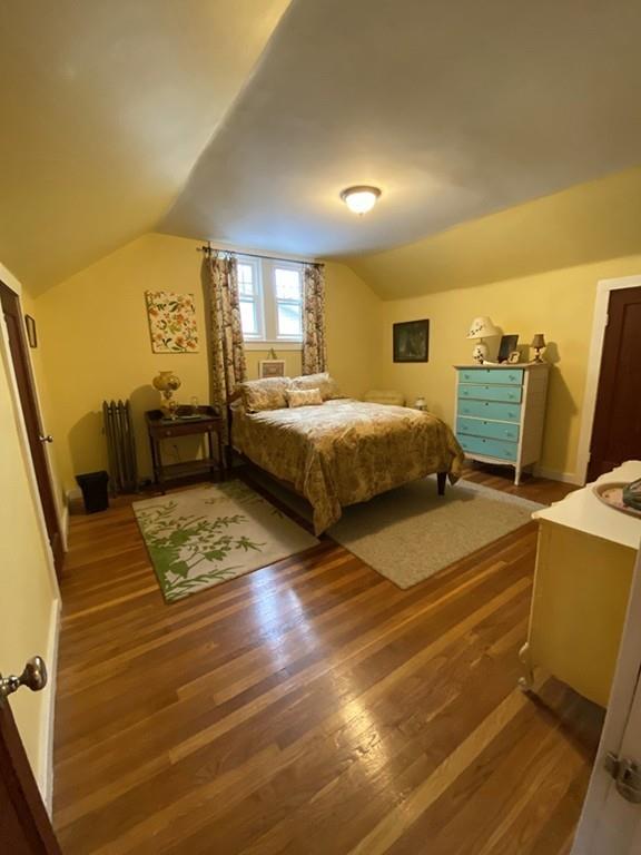 52 Sunapee Street Springfield, MA 01108 - Photo 21 of 33 a bedroom with double bed and wooden floor