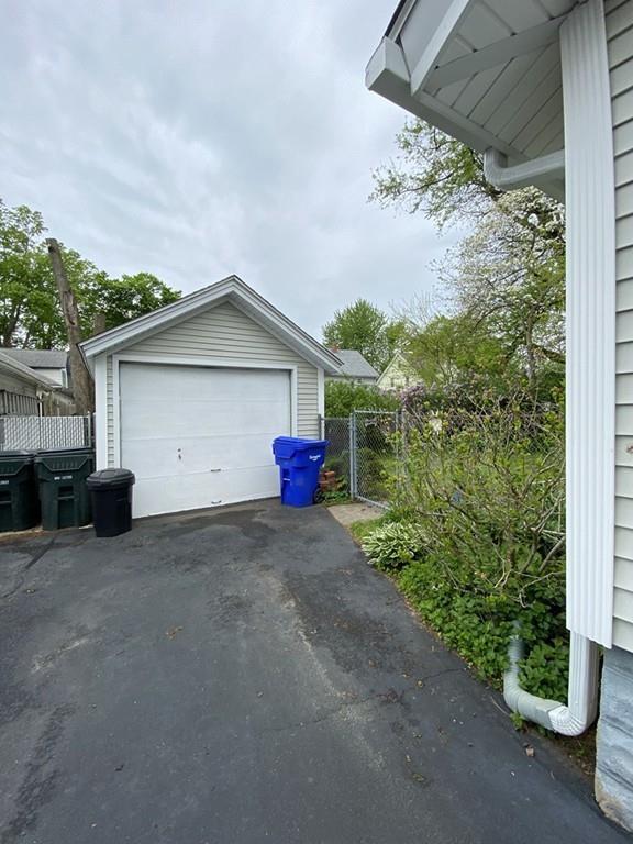 52 Sunapee Street Springfield, MA 01108 - Photo 3 of 33 a view of a house with a yard and garage