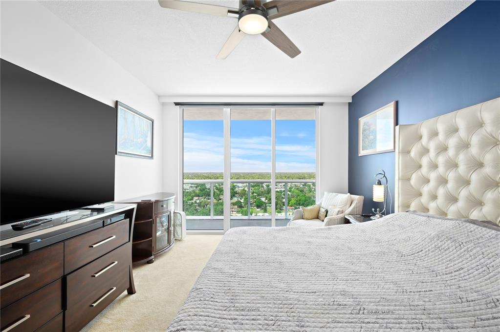 241 Riverside Drive, Unit 1909 Daytona Beach, FL 32117 - Photo 14 of 50 a bedroom with a bed and a window