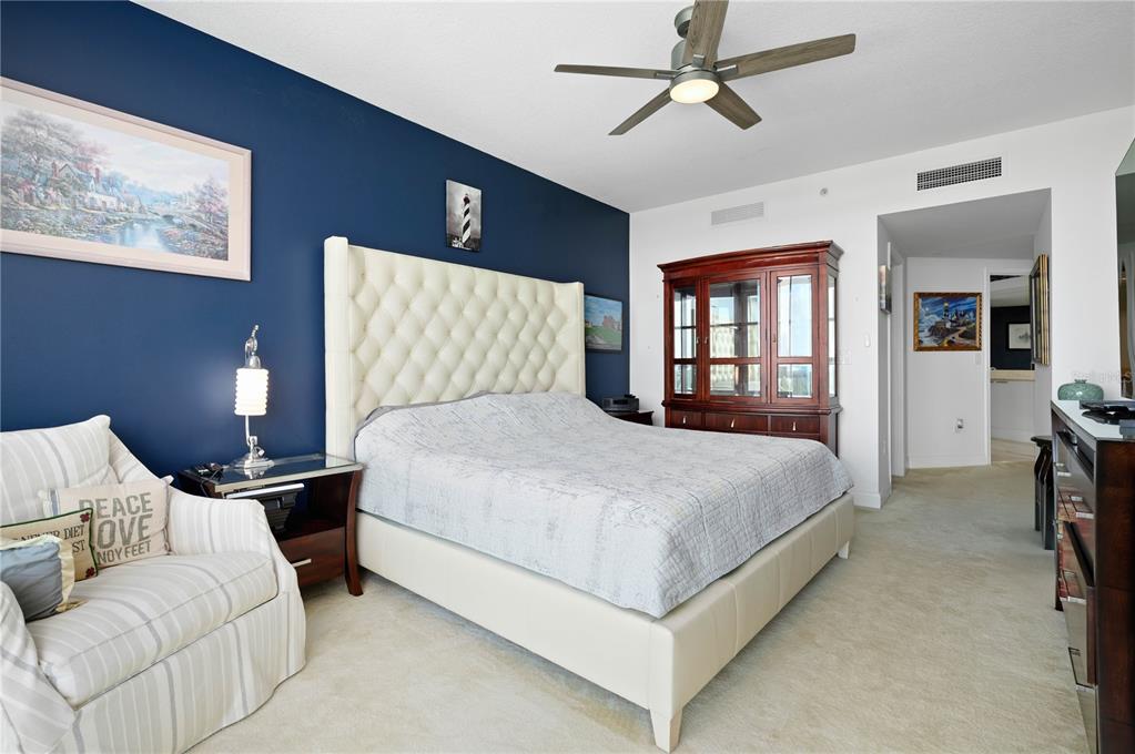 241 Riverside Drive, Unit 1909 Daytona Beach, FL 32117 - Photo 16 of 50 a bed room with a bed and a tv