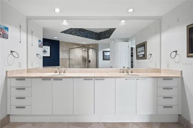 a bathroom with a double vanity sink and a mirror