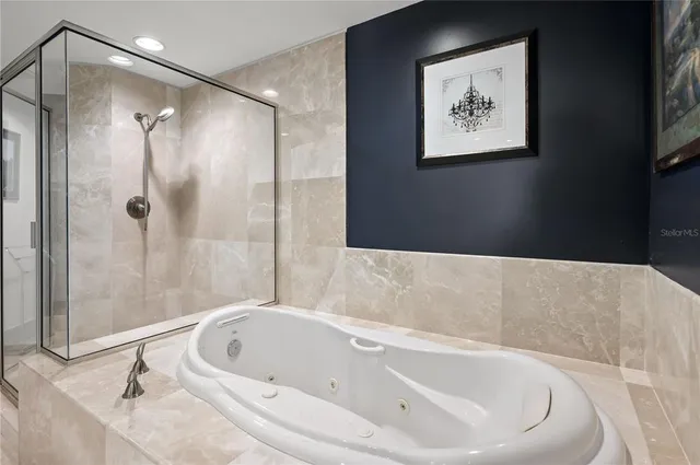 a bathroom with a bathtub and shower