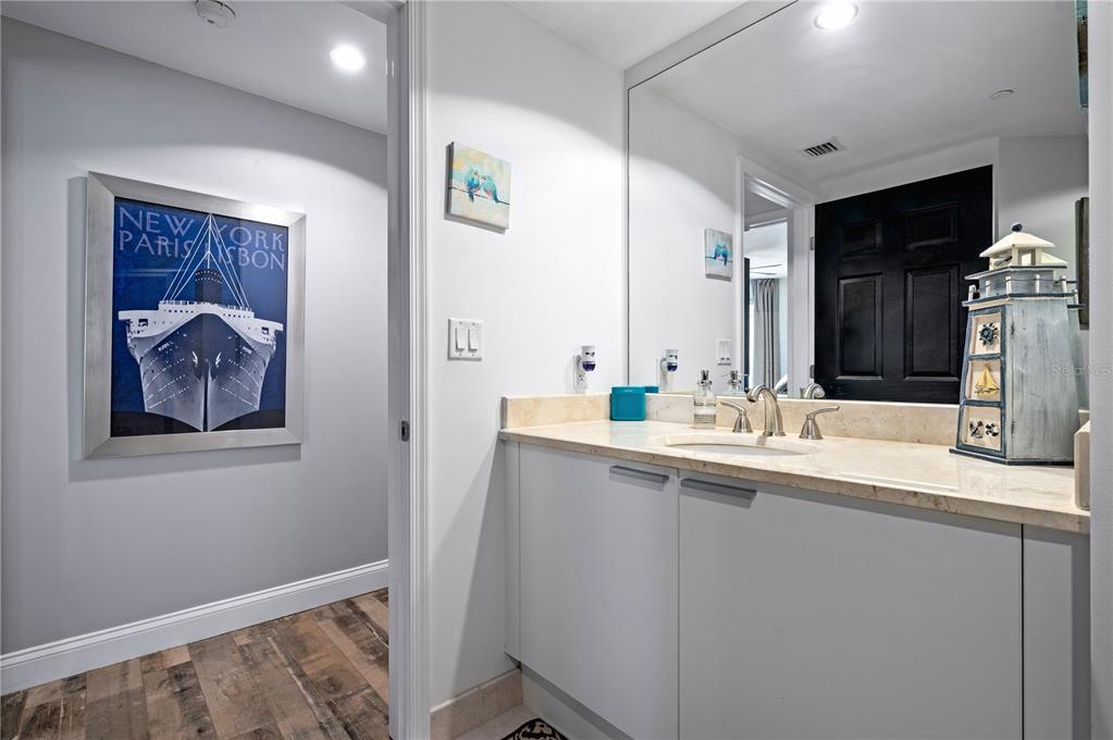 241 Riverside Drive, Unit 1909 Daytona Beach, FL 32117 - Photo 28 of 50 a bathroom with a sink and a mirror