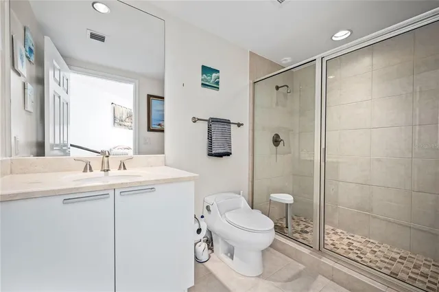 a bathroom with a sink toilet and shower