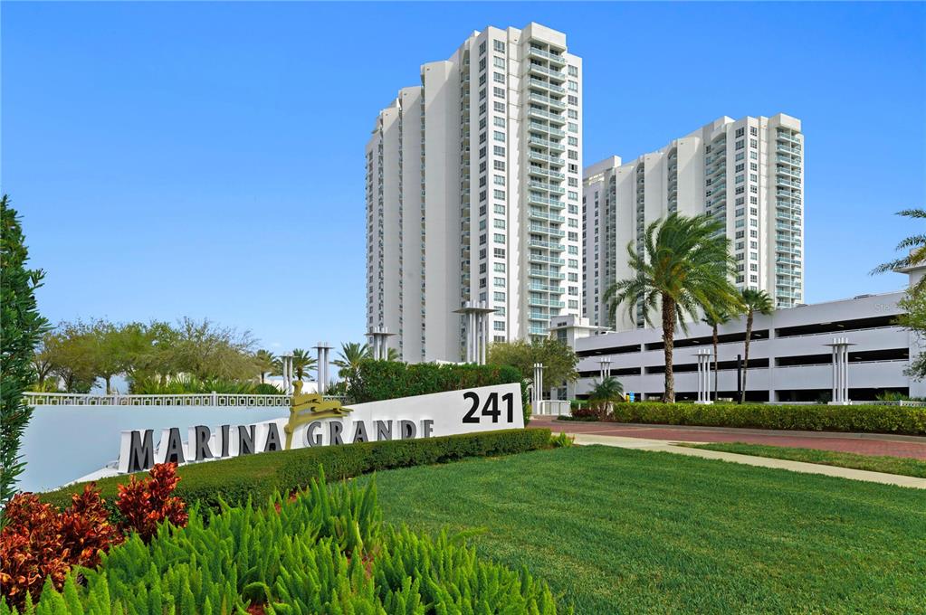241 Riverside Drive, Unit 1909 Daytona Beach, FL 32117 - Photo 37 of 50 a view of a tall building next to a lake